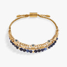 Set of gold stainless steel Evil Eye Stranded™ bracelets by ALEX AND ANI with eye charms and layered design.