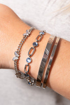 Silver ALEX AND ANI butterfly curb chain bracelet featuring stainless steel links and a delicate butterfly charm.