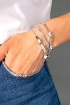 Silver butterfly curb chain bracelet by ALEX AND ANI featuring stainless steel links and intricate butterfly charms.