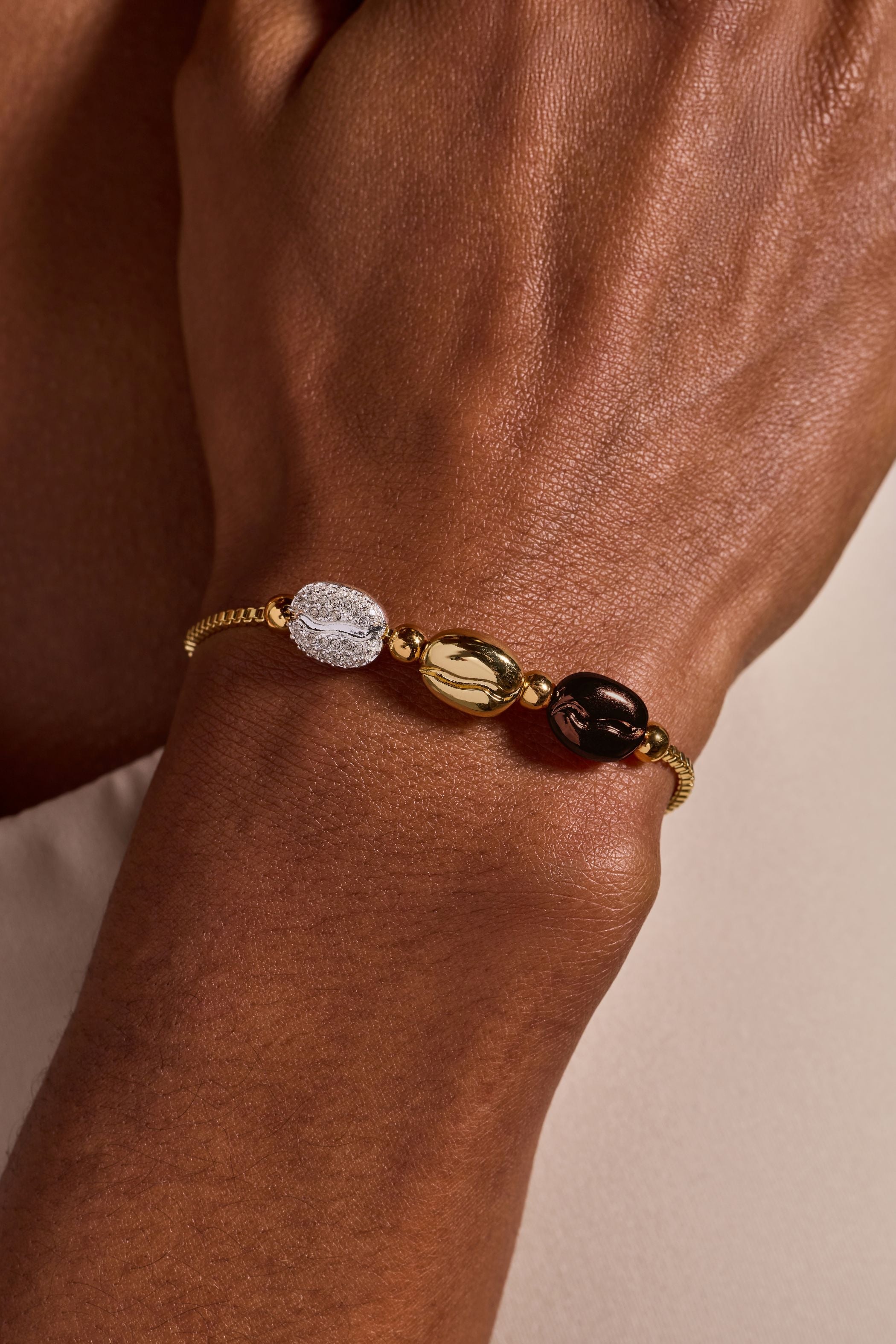 Tri-tone Coffee Bean Bolo Bracelet by Alex and Ani featuring a stylish coffee bean charm on adjustable bracelet.