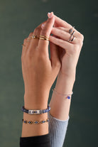 Two-tone antique evil eye stretch bracelet by ALEX AND ANI featuring eye charm and adjustable cord for a stylish accessory.