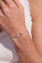 ALEX AND ANI PEEPS® Precious Peepsake bracelet featuring two-tone metal charms on a delicate bracelet.