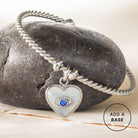 Silver stainless steel Evil Eye Heart charm by ALEX AND ANI, featuring an interchangeable design with detailed eye and heart motifs.