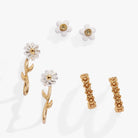 Set of three gold Daisy flower stud and huggie hoop earrings by ALEX AND ANI, featuring floral jewelry design.