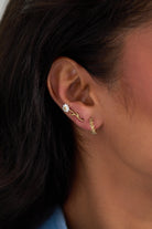 Gold Daisy Flower stud and huggie hoop earrings set of 3 by ALEX AND ANI, featuring daisy flower designs in a mix of stud and hoop styles.