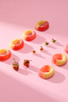 Set of three gold 'Trick or Treat' earrings by ALEX AND ANI, featuring festive Halloween-themed designs.