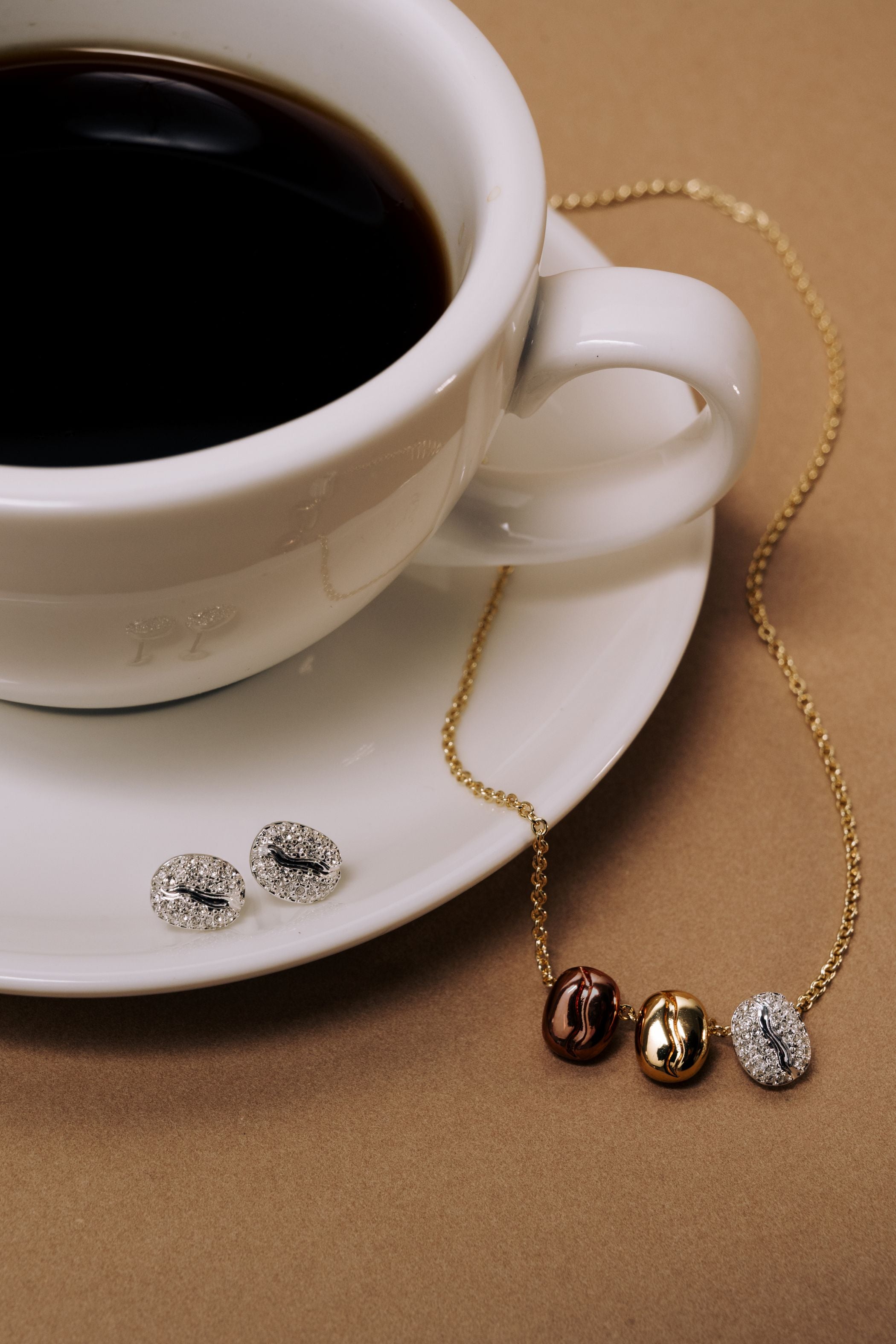 Silver Coffee Bean Pave Crystal Stud Earrings by ALEX AND ANI, featuring sparkling crystal accents on small, stylish stud earrings.