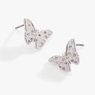 Silver glass butterfly statement stud earrings by ALEX AND ANI featuring intricate butterfly design and shiny finish.