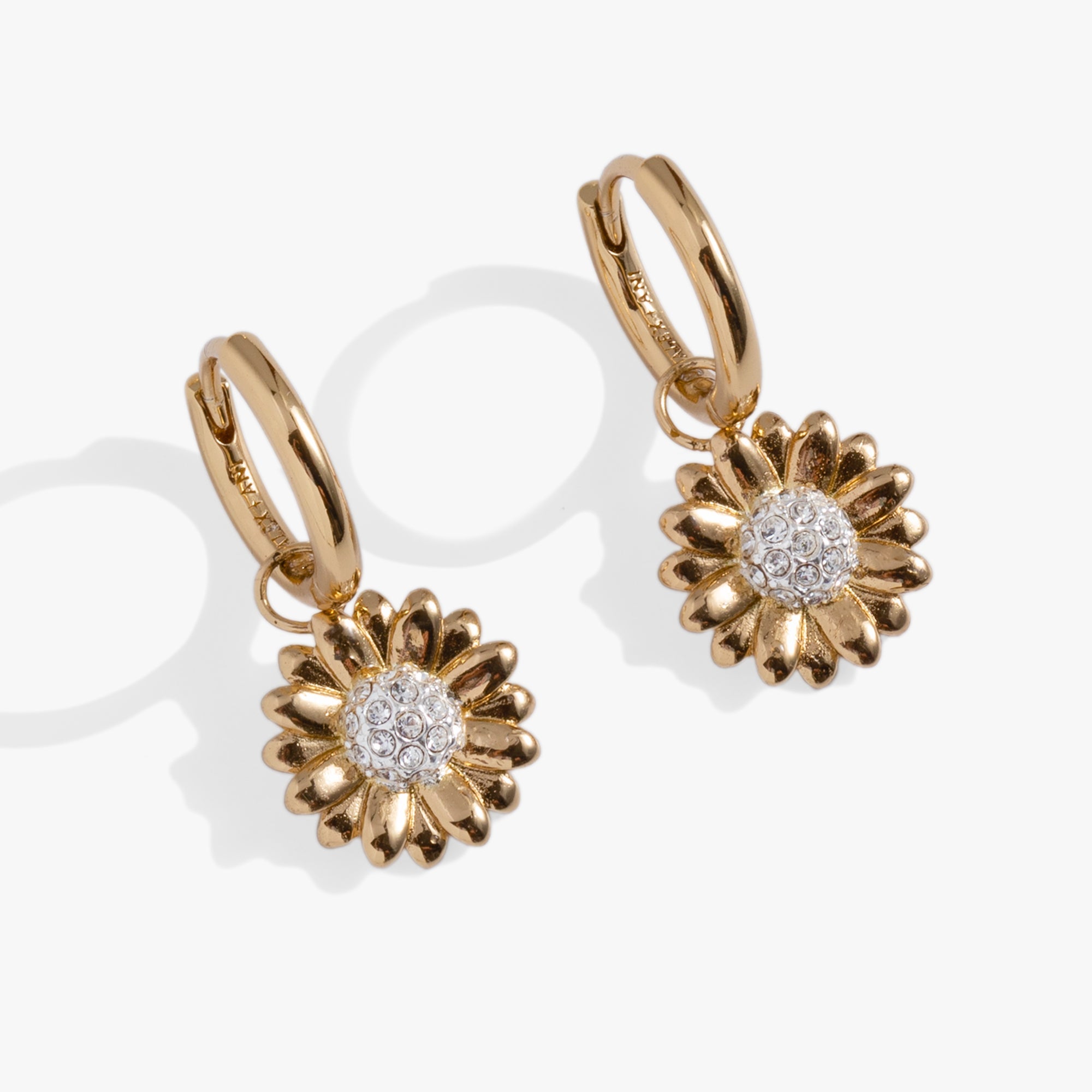 Two-tone sunflower huggie hoop earrings by ALEX AND ANI featuring detailed sunflower design and polished finish.