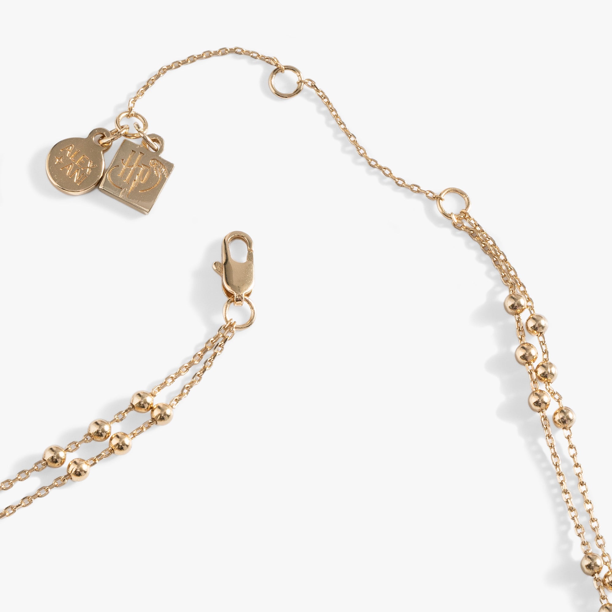 Gold Harry Potter Flying Keys Necklace by ALEX AND ANI featuring a detailed key pendant on a delicate chain.