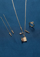 Gold Harry Potter Hogwarts Great Hall Cluster Charm Necklace by ALEX AND ANI with detailed Hogwarts-themed charms.