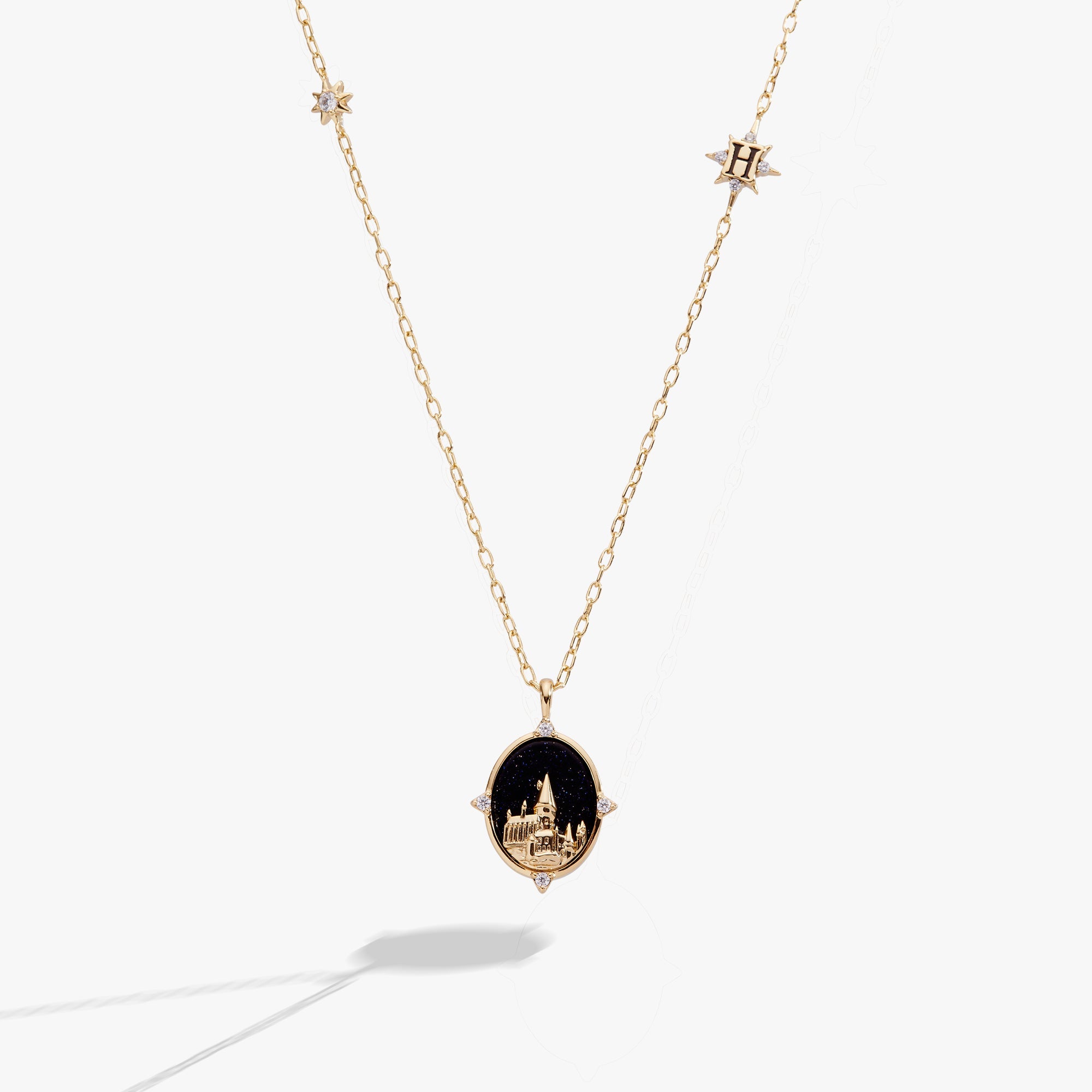 Gold Harry Potter Hogwarts pendant necklace by ALEX AND ANI featuring the iconic Hogwarts crest charm.