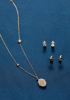 Gold Harry Potter Hogwarts pendant necklace by ALEX AND ANI featuring a detailed Hogwarts crest charm.