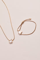 Gold pearlized Dove 'Peace' slider necklace by ALEX AND ANI, featuring a dove pendant on a delicate chain.