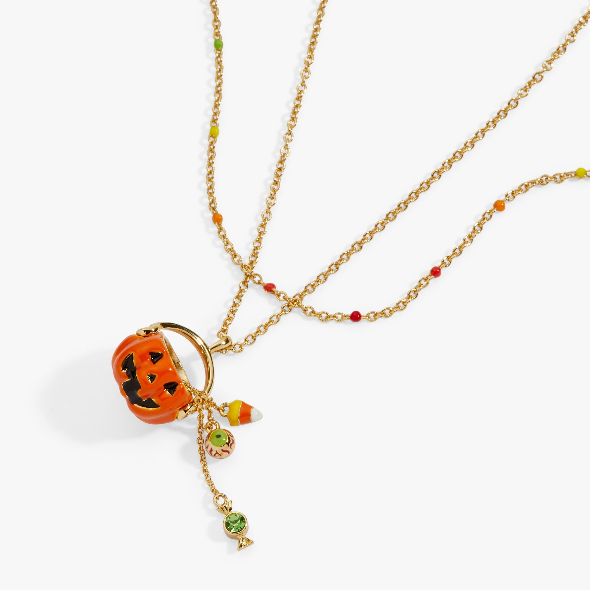 Gold 'Trick or Treat' layered necklace by ALEX AND ANI featuring Halloween-themed charms and intricate chain details.