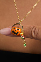 Gold 'Trick or Treat' layered necklace by ALEX AND ANI featuring Halloween-themed charms and intricate design.