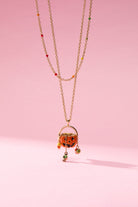 Gold 'Trick or Treat' layered necklace by ALEX AND ANI featuring playful Halloween-themed charms.