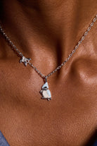 Silver Tufted Titmouse bird pendant necklace by ALEX AND ANI, featuring detailed bird design on a chain.