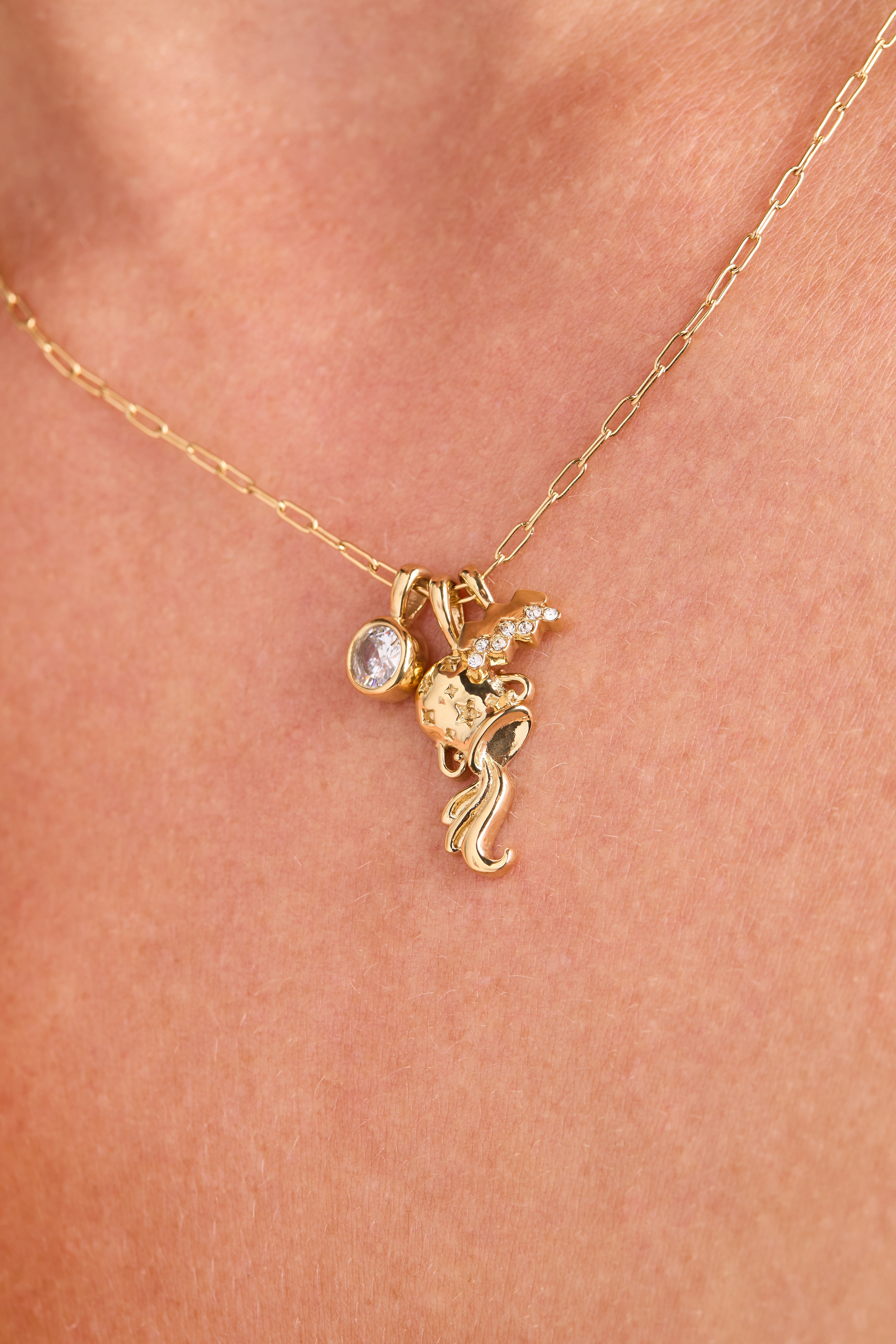 Gold stainless steel Aquarius zodiac charm cluster necklace by ALEX AND ANI featuring celestial-inspired charms and intricate design.