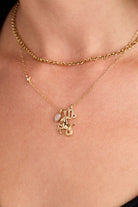 Gold Capricorn Zodiac Charm Cluster Necklace by ALEX AND ANI featuring stainless steel chain and zodiac-inspired charms.