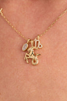 Gold Capricorn Zodiac Charm Cluster Necklace by ALEX AND ANI featuring stainless steel chain and zodiac pendant.