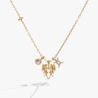 Gold stainless steel Gemini Zodiac Charm Cluster Necklace by ALEX AND ANI featuring celestial charms and intricate design.