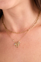 Gold stainless steel Gemini Zodiac Charm Cluster Necklace by ALEX AND ANI with multiple zodiac charms on a delicate chain.