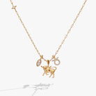 Gold Taurus Zodiac Charm Cluster Necklace by ALEX AND ANI, stainless steel with zodiac-themed charms on a delicate chain.