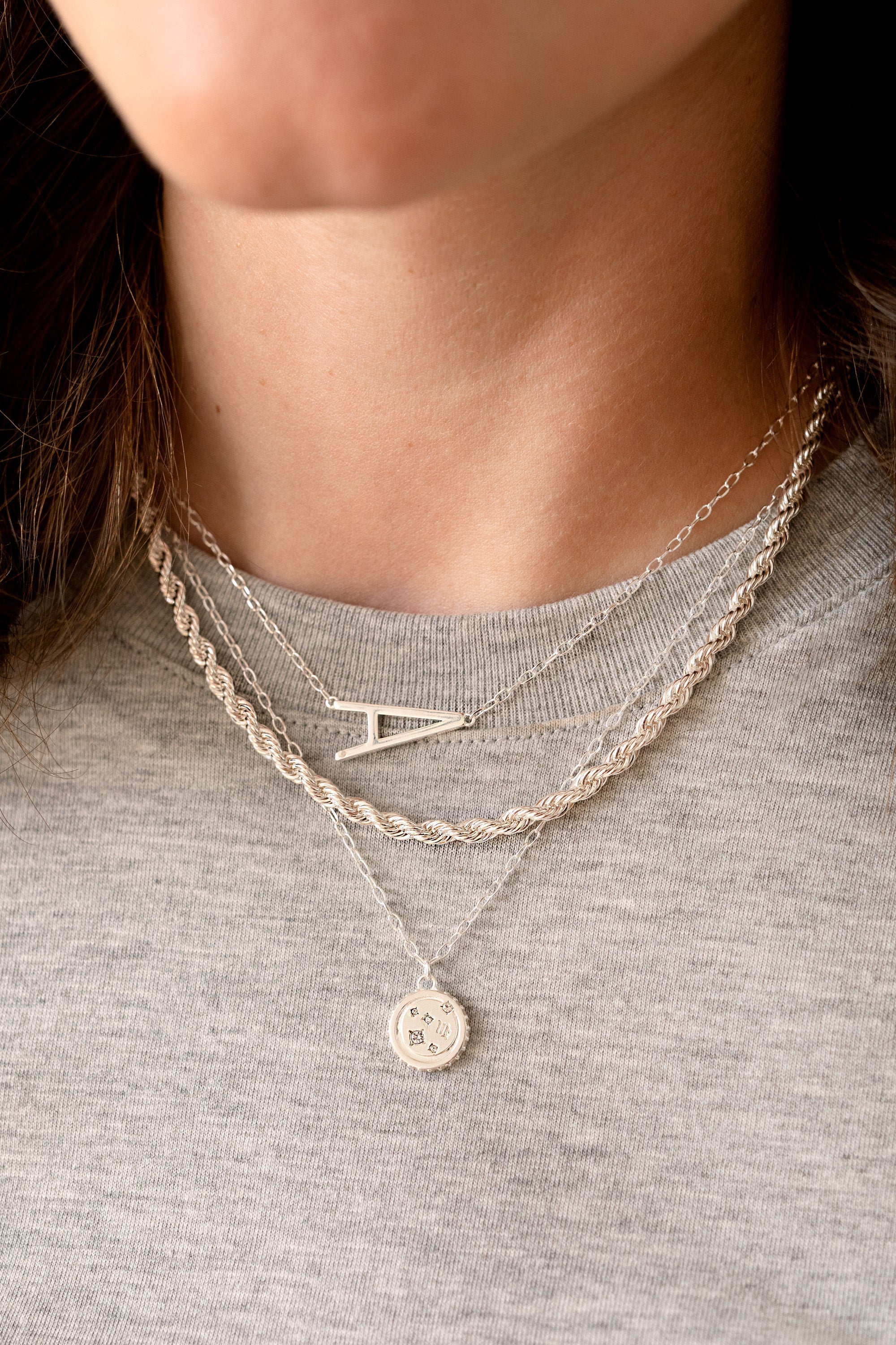 Sterling silver Virgo Zodiac necklace by ALEX AND ANI featuring a pendant with zodiac symbol on a delicate chain.