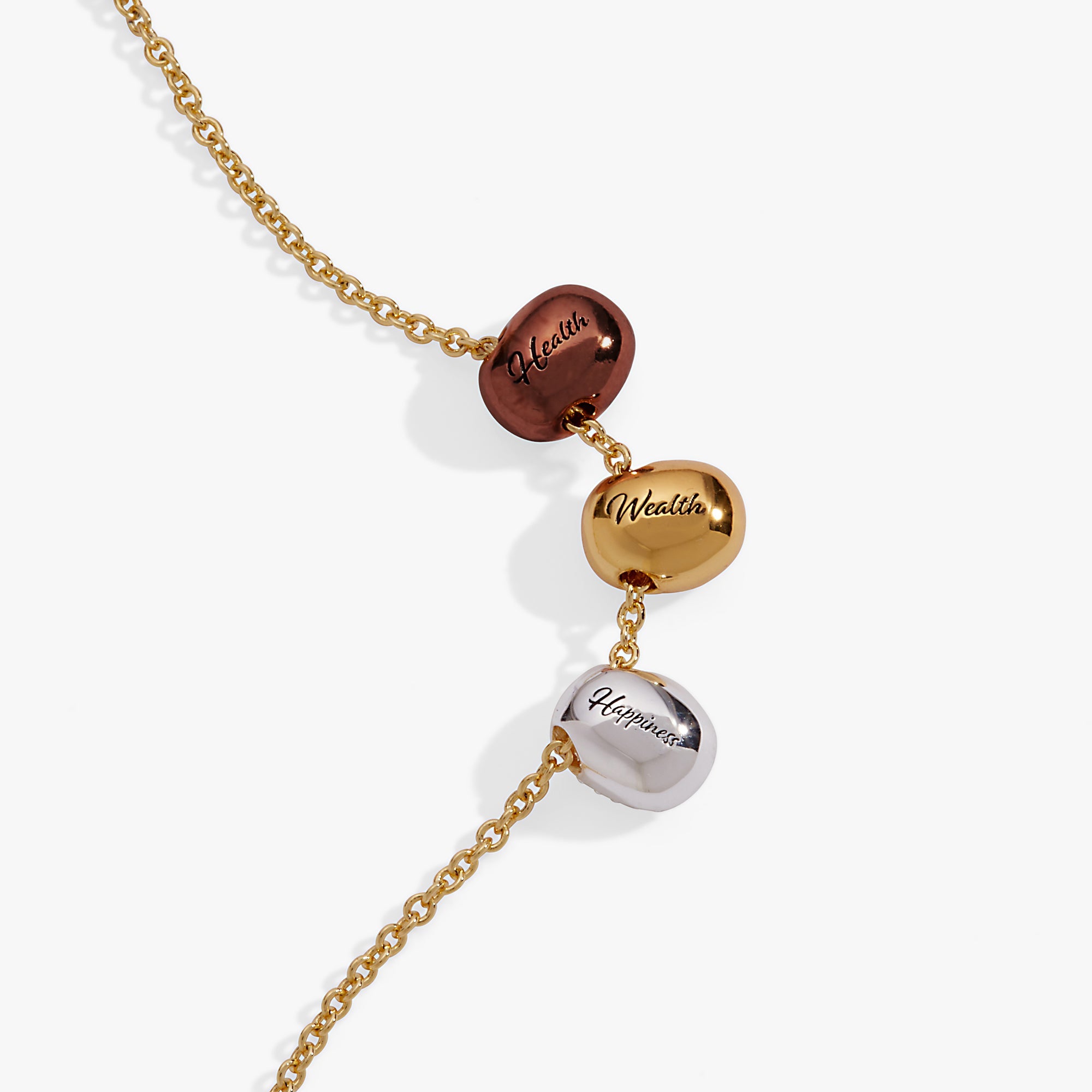 Tri-tone engraved pendant necklace featuring a coffee bean design with symbols for happiness, wealth, and health by ALEX AND ANI.