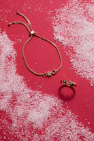 Gold Lucky Horseshoe Ring by ALEX AND ANI, showcasing a detailed horseshoe design on a sleek ring.