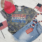America America America camouflage short sleeve graphic T-shirt by The Graphic Tee, featuring bold patriotic design.
