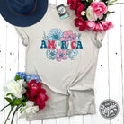 America Floral Heather Dust short sleeve graphic tee by The Graphic Tee featuring a floral design on heather fabric.