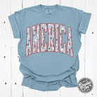 America Star Spangled Pigment Dyed Short Sleeve Graphic Tee featuring patriotic star design and vibrant colors by The Graphic Tee.