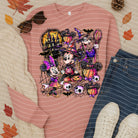 Black Spooky Friends graphic tee by Anchored Grace Boutique, featuring playful Halloween-themed designs on soft fabric.