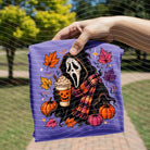 White Fall Scream graphic tee from Anchored Grace Boutique featuring a spooky Halloween-inspired design on soft cotton fabric.