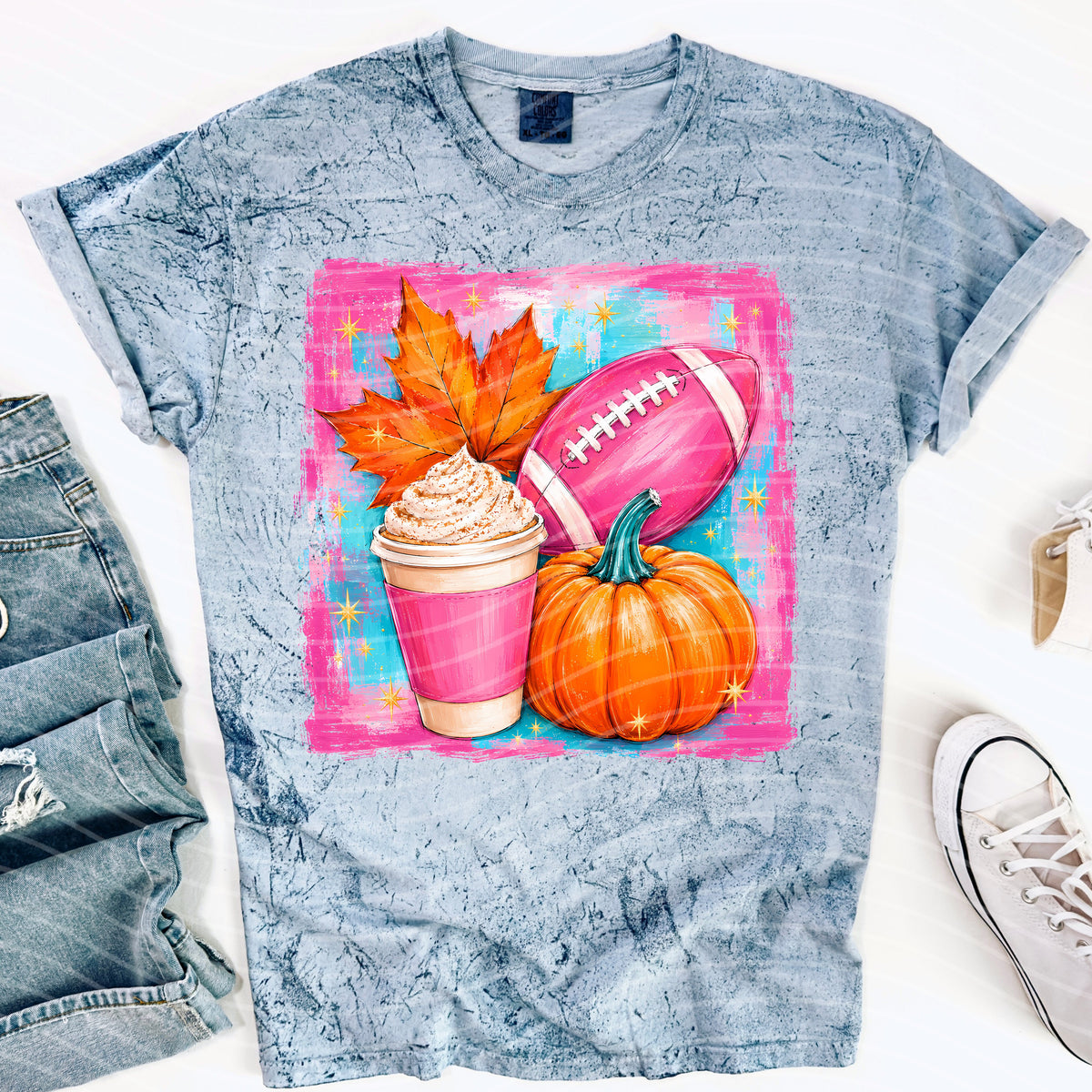 Football and fall-themed graphic tee from Anchored Grace Boutique featuring autumn leaves and football illustrations.