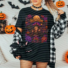 White Halloweentown graphic tee by Anchored Grace Boutique featuring Halloween-themed design on soft cotton fabric.