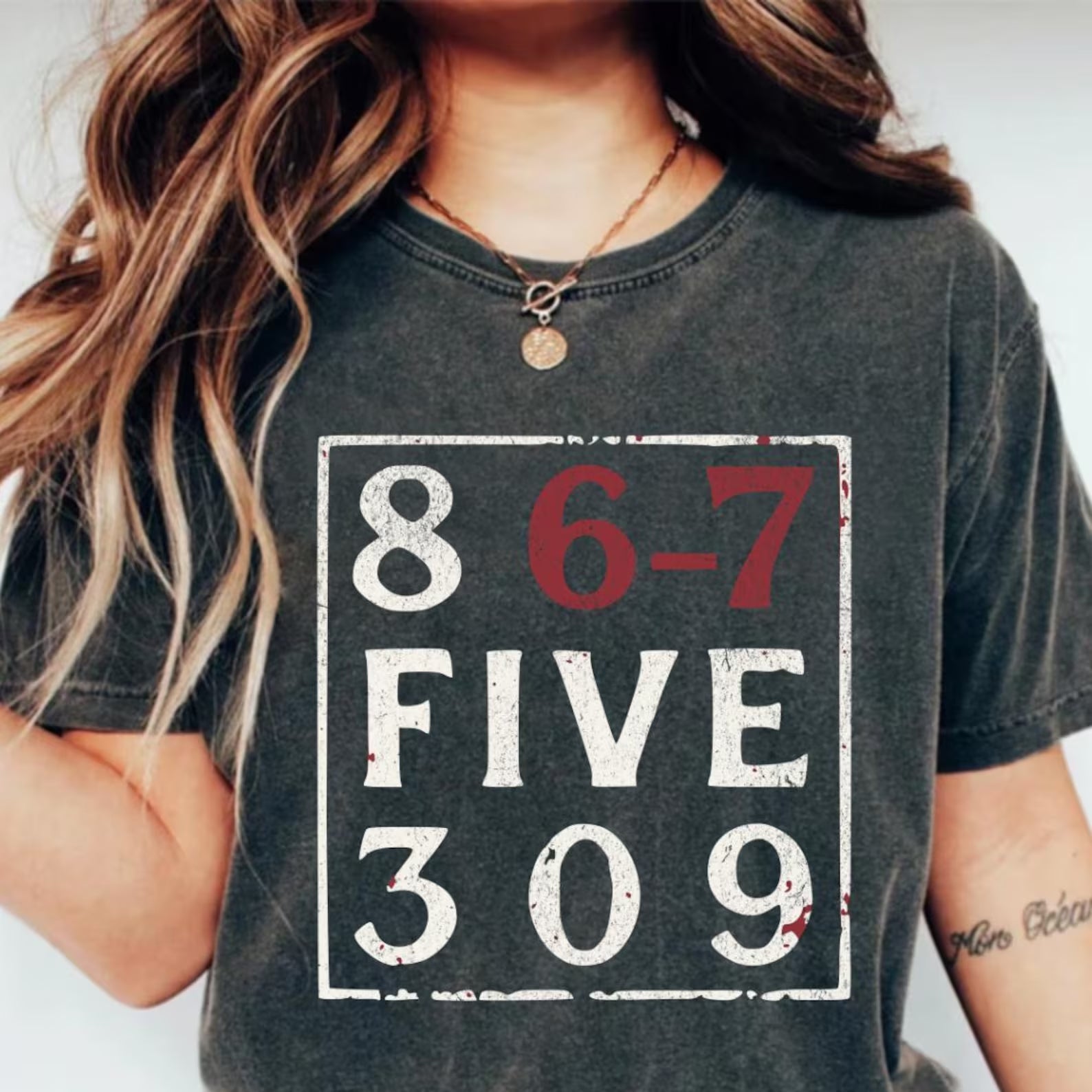 Anchored Grace Boutique 8675309 graphic tee featuring a bold, colorful design on a casual cotton t-shirt.