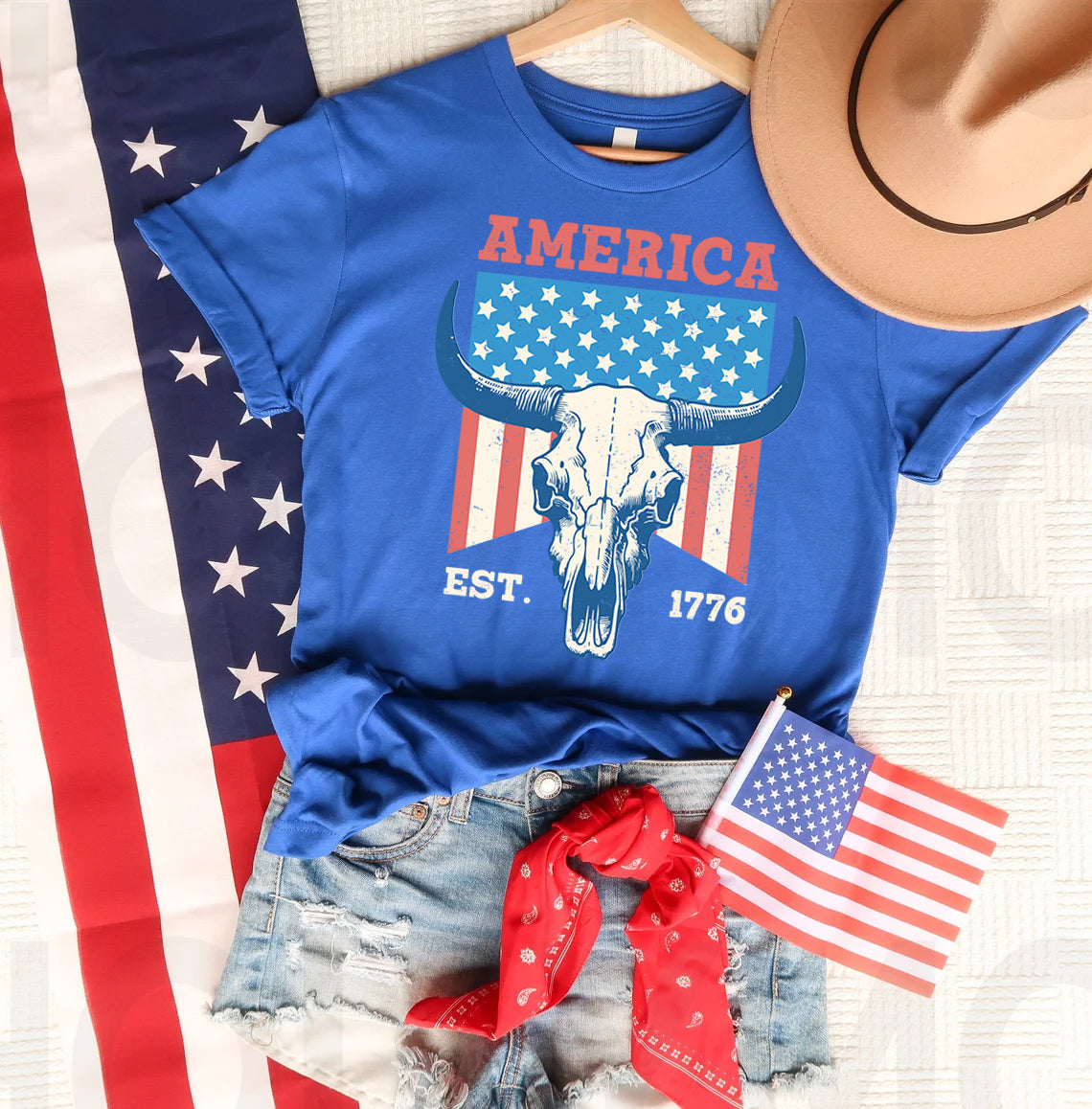 American Est 1776 graphic tee by Anchored Grace Boutique, featuring patriotic design and casual fit for women.