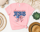 America Needs Jesus graphic tee by Anchored Grace Boutique, featuring bold text design on a casual cotton t-shirt.