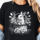 Black and white bunny graphic tee from Anchored Grace Boutique featuring a playful bunny illustration on soft cotton fabric.