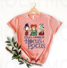Bluey It's All a Bunch of Hocus Pocus graphic tee by Anchored Grace Boutique, featuring a fun, colorful design on a casual cotton t-shirt.