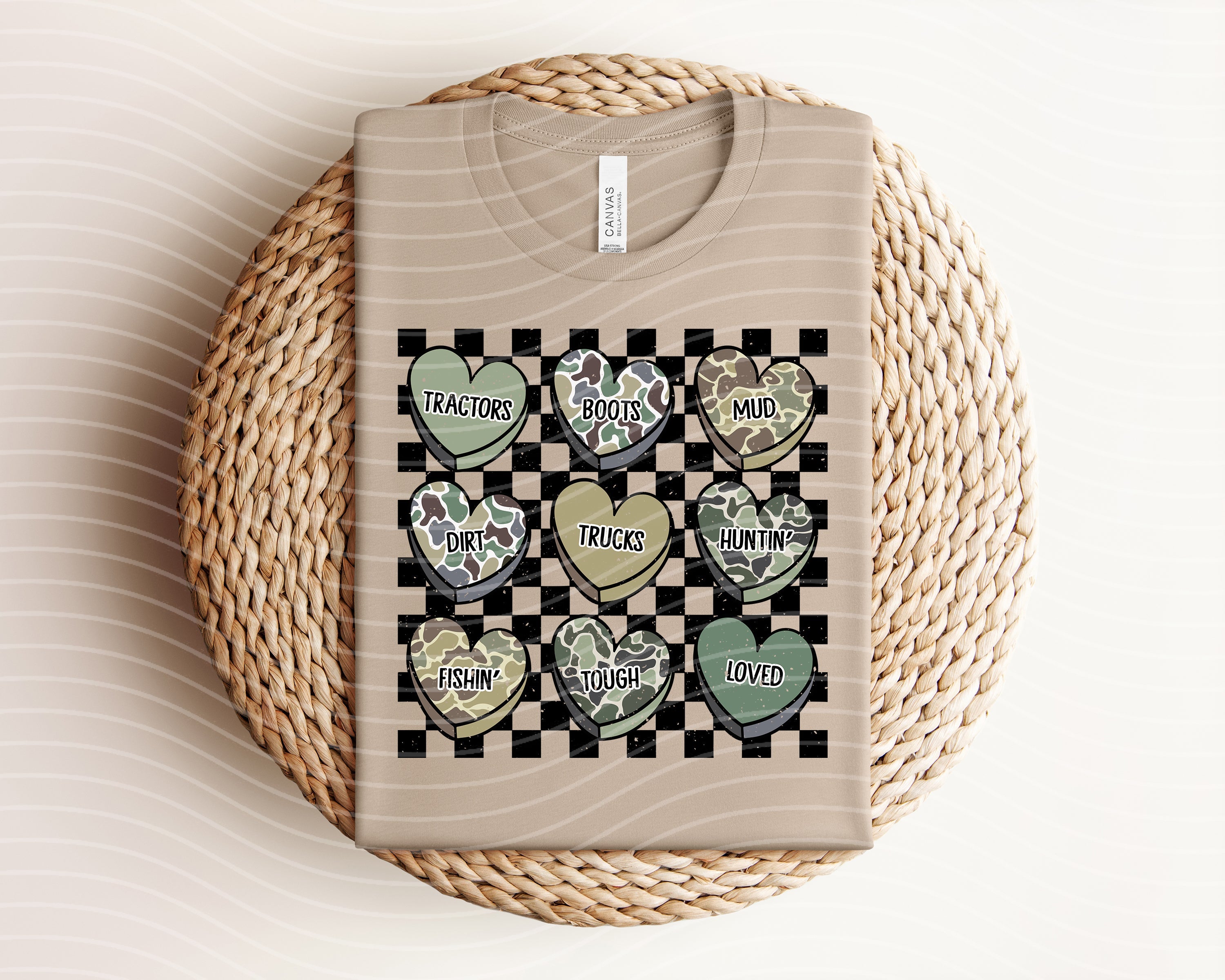 Camo Hearts graphic tee by Anchored Grace Boutique featuring a stylish camouflage pattern with heart designs.