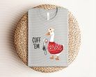 Anchored Grace Boutique Cuff Em Graphic Tee featuring bold graphic design and casual fit, displayed on a plain background.