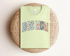 Dog Mom graphic tee by Anchored Grace Boutique featuring a stylish design on a comfortable cotton t-shirt.