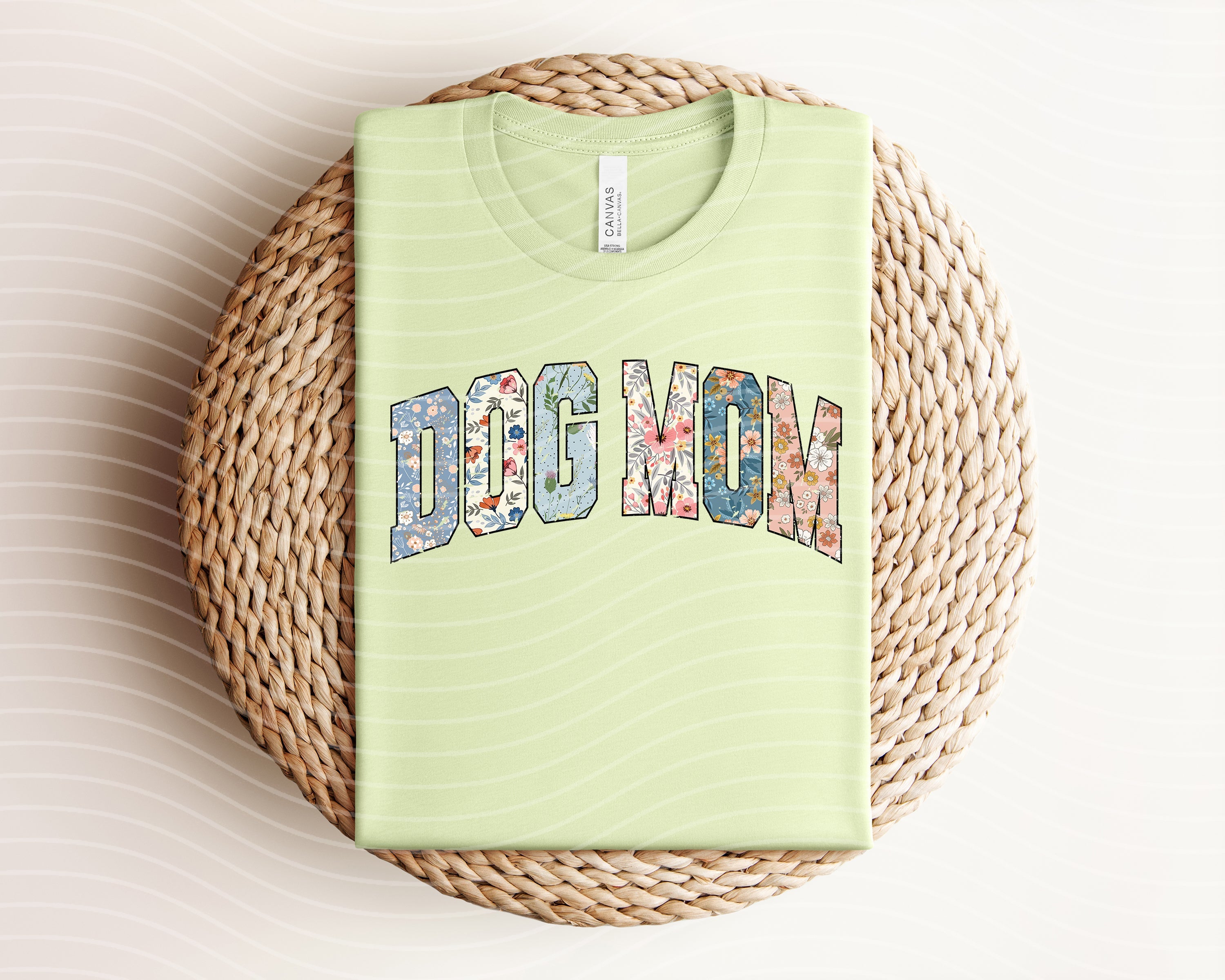 Dog Mom graphic tee by Anchored Grace Boutique featuring a stylish design on a comfortable cotton t-shirt.