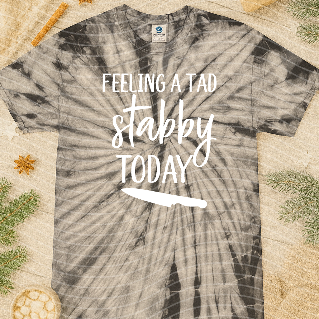 Feeling a Tad Bit Stabby Today graphic tee from Anchored Grace Boutique, featuring bold text on a casual cotton T-shirt.