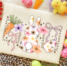 Floral Bunny graphic tee from Anchored Grace Boutique featuring colorful bunny and floral design on soft cotton fabric.