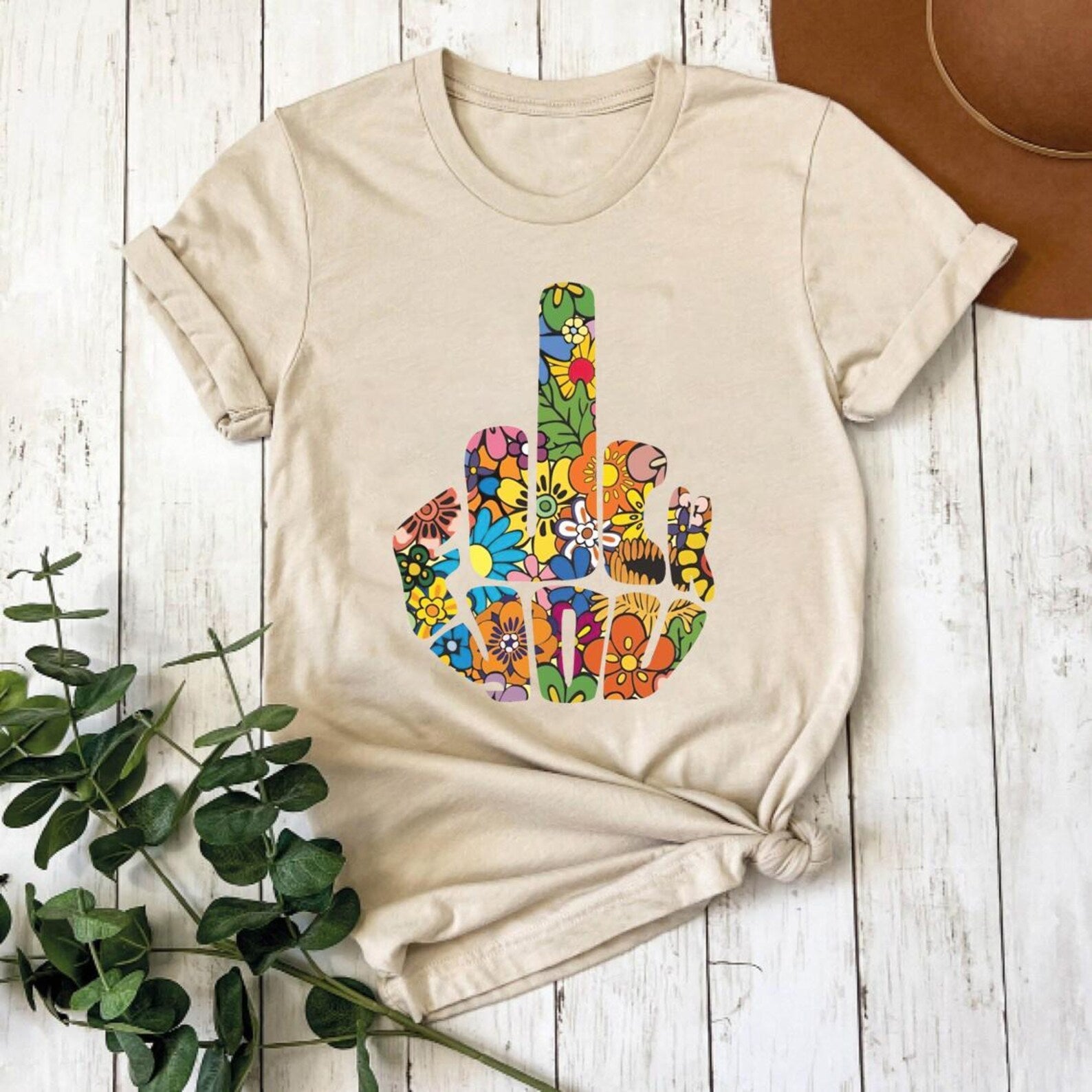 Floral finger graphic tee by Anchored Grace Boutique featuring a vibrant floral design on a casual graphic t-shirt.
